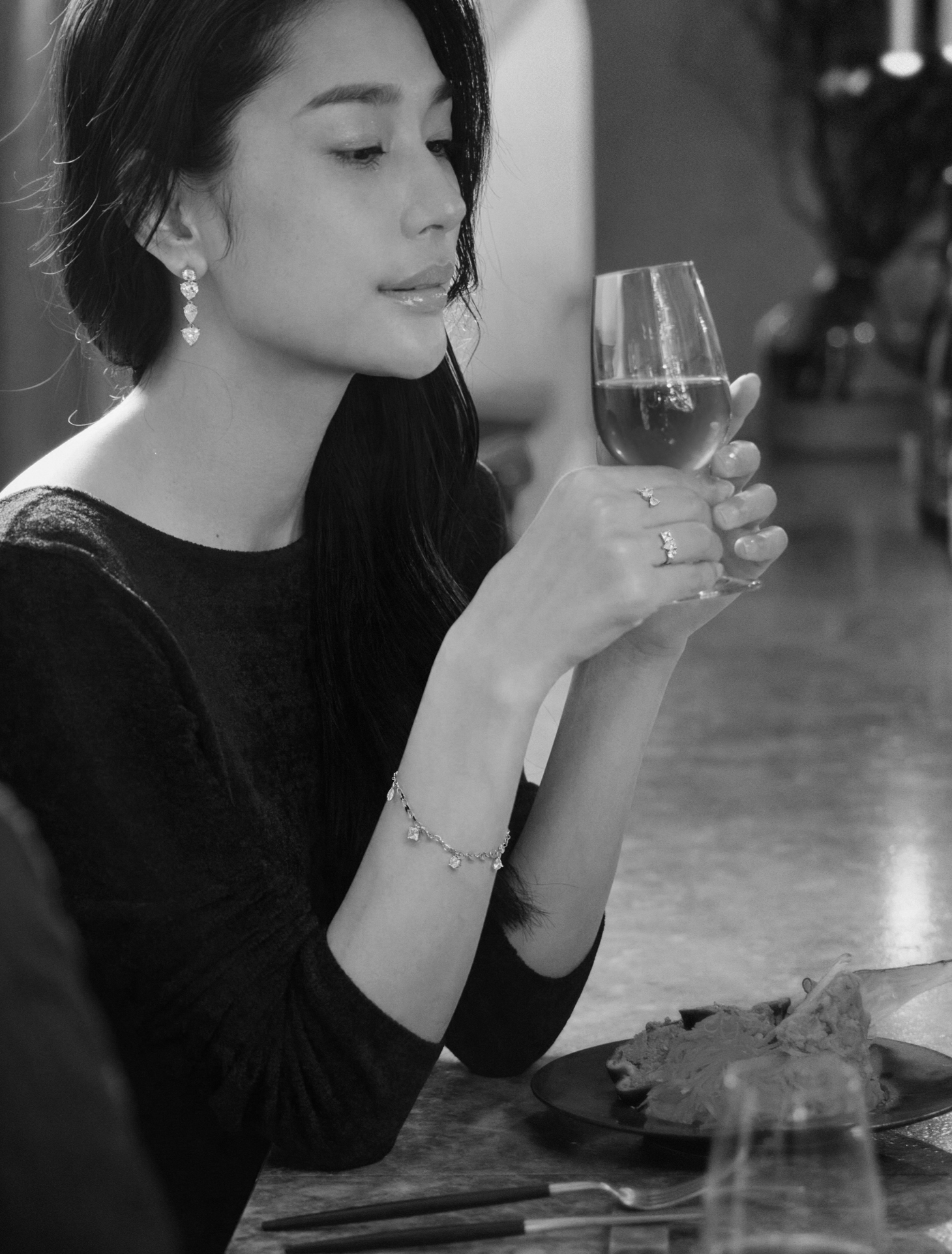 Woman holding a wine glass - monochrome