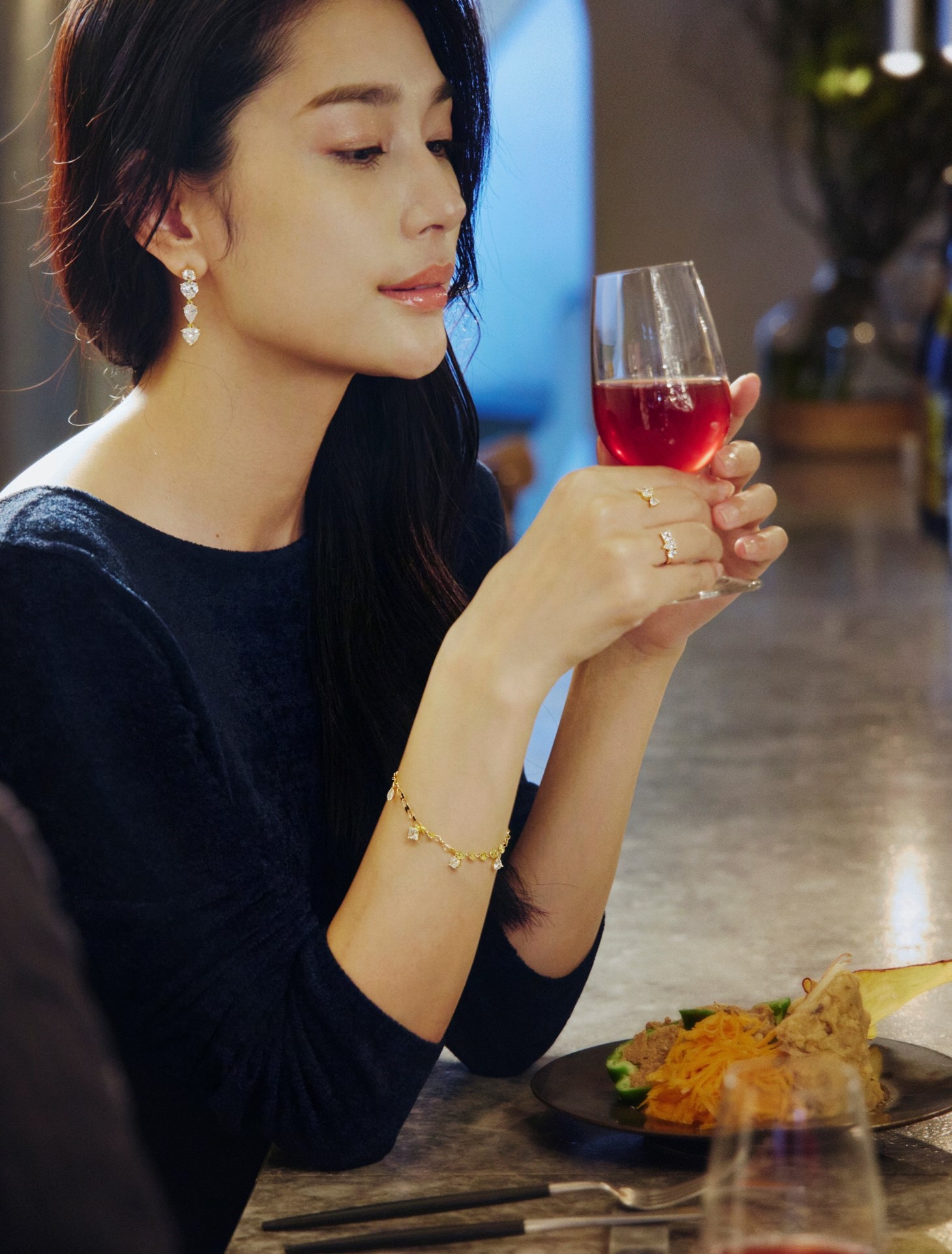 Woman holding a wine glass - color